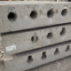 Custom precast concrete utility structure with specialized openings designed for infrastructure project requirements.