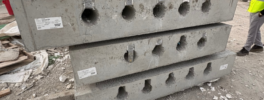 Custom precast concrete utility structure with specialized openings designed for infrastructure project requirements.