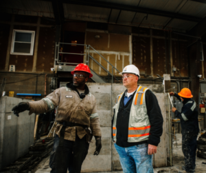 Roman Stone team discussing the precast concrete manufacturing process
